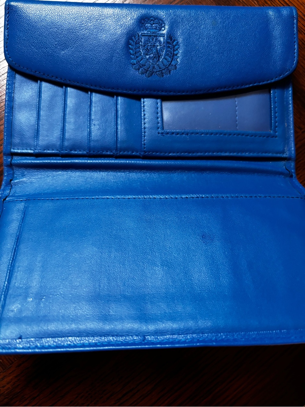 Mundi genuine leather wallet featuring a royal blue color, card slots, a clear